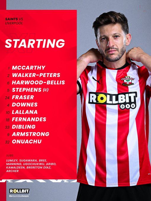 Southampton starting team: McCarthy, Walker-Peters, Harwood-Bellis, Stephens (captain), Fraser, Downes, Lallana, Fernandes, Dibling, Armstrong, Onuachu. Substitutes: Lumley, Sugawara, Bree, Manning, Ugochukwu, Aribo, Kamaldeen, Brereton Díaz, Archer. On the right side of the line-up graphic is a picture of Adam Lallana in the red-and-white home shirt, looking straight towards camera with a focused look on his face. Lallana, who is pictured against a grey background, is pulling at the back of his collar with both hands. On the left side of the graphic is the line-up text, which is printed in white lettering against a textured red background.